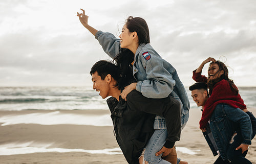 Cheerful friends enjoying on the beach
