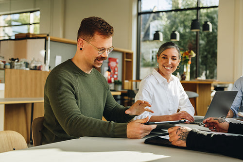 Colleagues planning strategy sitting at table
