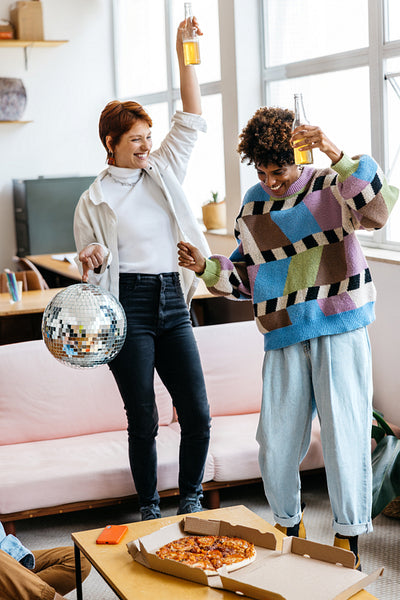 Colleagues celebrating with drinks in a co-working space
