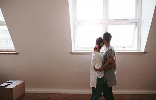 Loving young couple moving in a new apartment