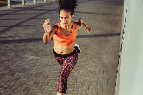 Runner sprinting on the pavement