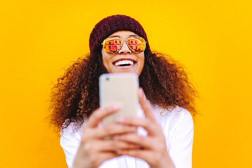 Stylish african woman making selfie