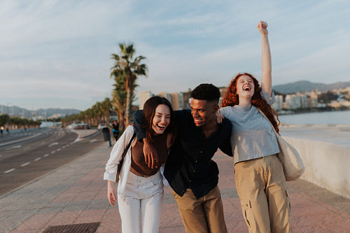 Joyful friends having a good time in the waterfront