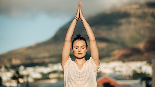 Woman doing yoga outdoors