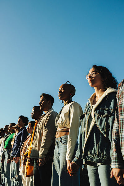Diverse group of individuals standing in solidarity during a peaceful demonstration