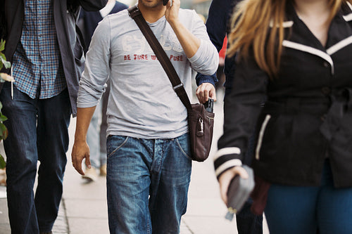 Theif stealing wallet from man's handbag