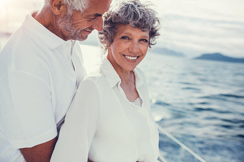 Senior couple enjoying their summer holidays on boat trip