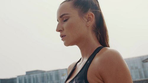 Tired fitness woman taking rest