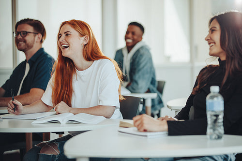 Students smiling in a high school lecture