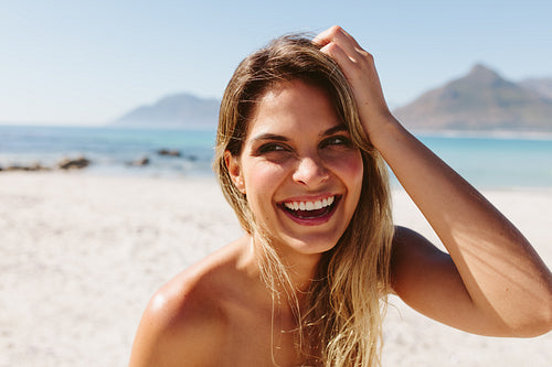 Smiling young woman on the beach