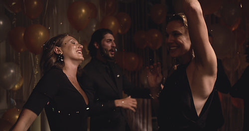 Women having a great time dancing in a party