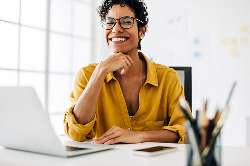 Black business woman working from her desk in an office