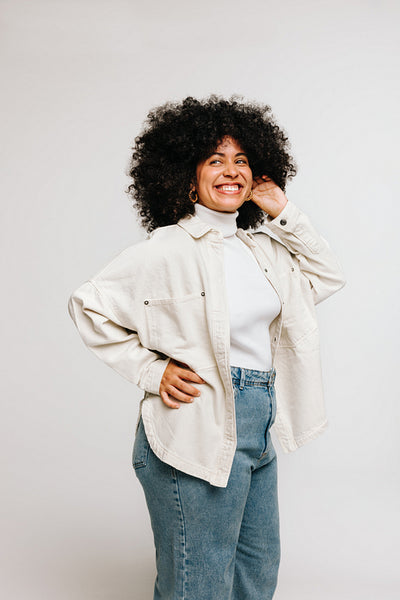 Beautiful woman with an Afro hairstyle looking away with a smile