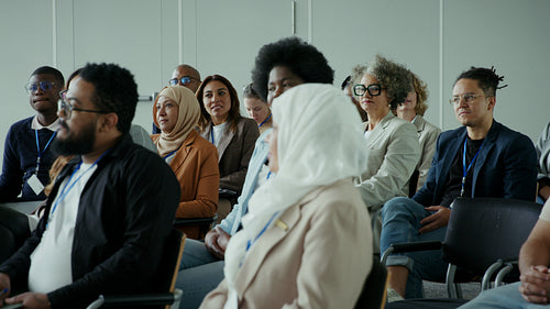 Group of business professionals listening and learning during a presentation