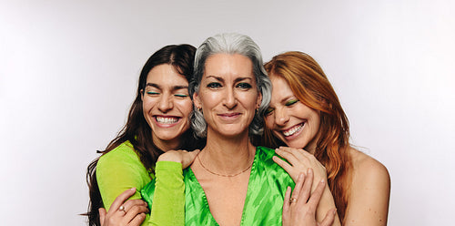 Three female models of different ages in bold fashion campaign