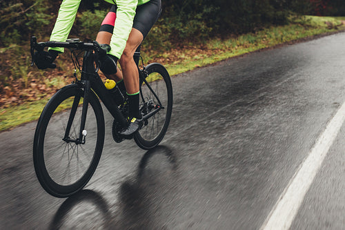 Cyclist training outdoors on a rainy day