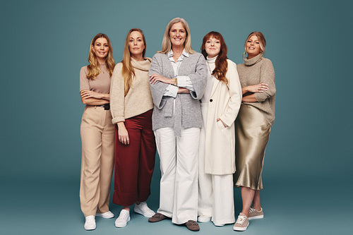 Caucasian women of different ages standing together in a studio
