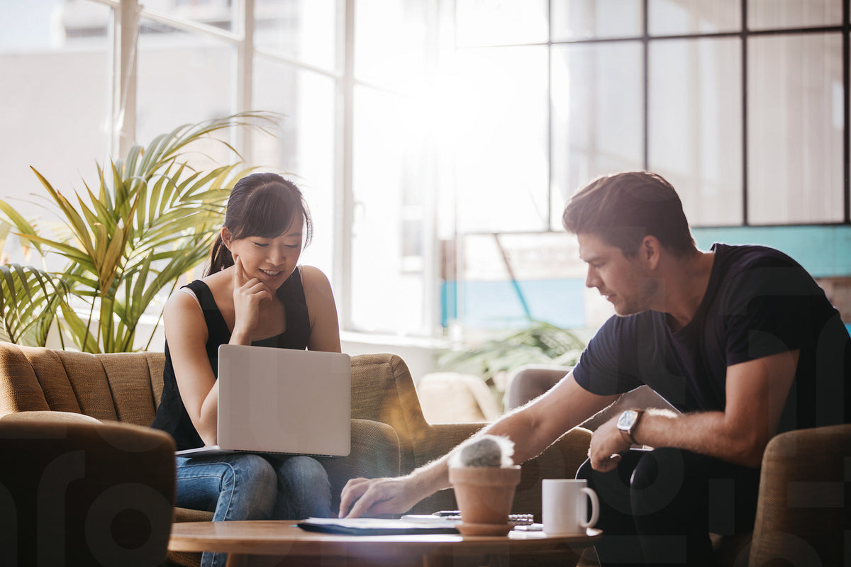 Two people working together in office lobby – Jacob Lund Photography ...
