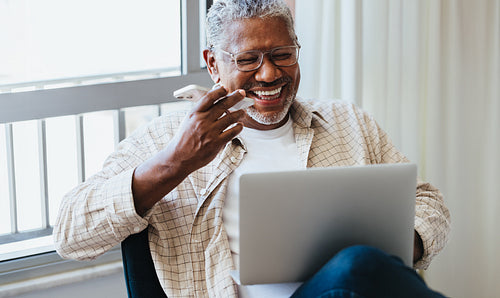Tech-Savvy Senior: Mature businessman working remotely