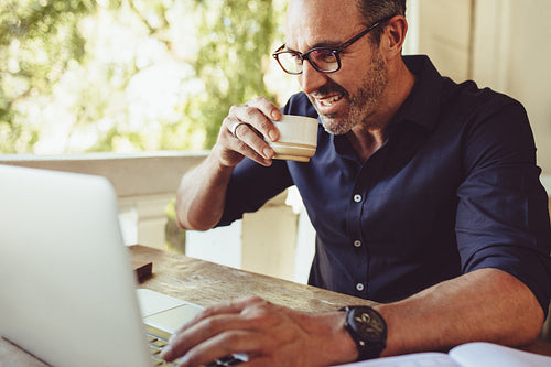 Businessman doing his work from a cafe
