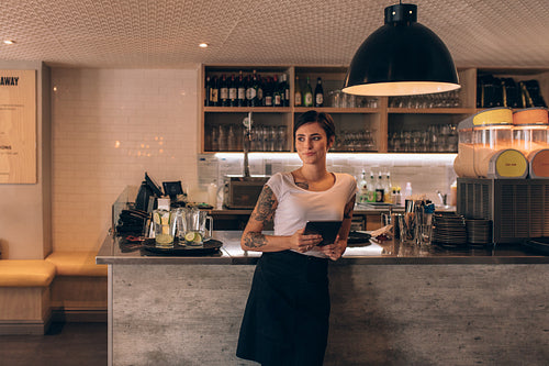 Cafe owner standing at the counter