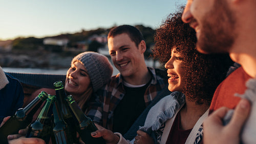 Group of friends having party at beach