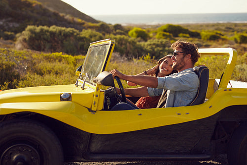 Smiling couple going on holidays together on a summer day