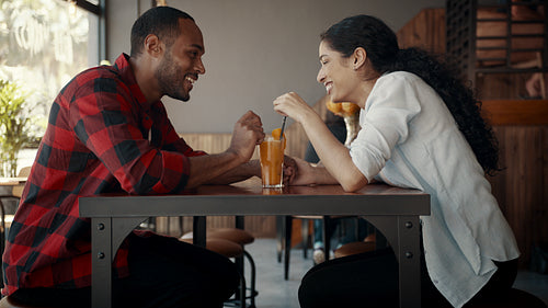 Loving couple enjoying on a date at cafe