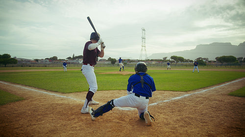 Baseball batter watches a pitch during a game