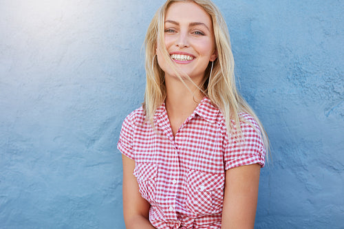 Cheerful young woman looking at camera and smiling