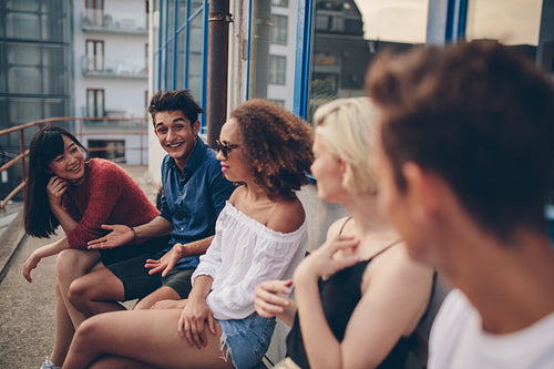 Group of young people relaxing in terrace