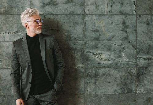 Handsome mature businessman looking at copy space