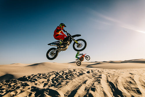 Motocross riders in midair