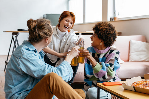 Colleagues celebrating success in a modern co-working space