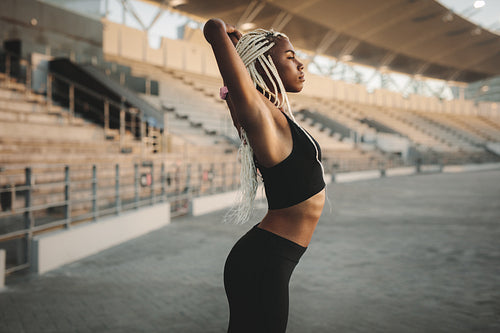 Athlete working out near the stands in a stadium