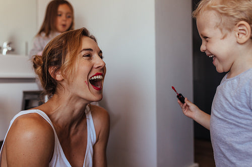 Mother and son playing with makeup