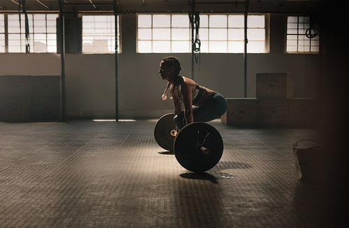Fitness woman doing weightlifting exercise