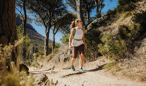 Woman hiking on a mountain trail