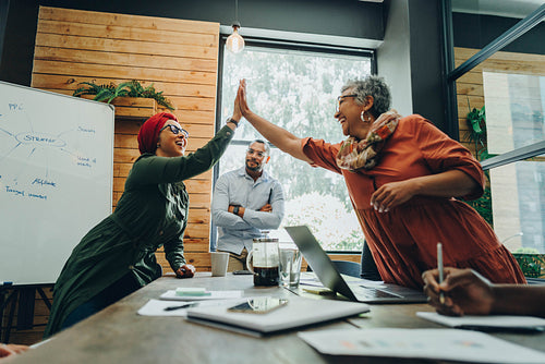 Happy businesswomen celebrating their success in an office
