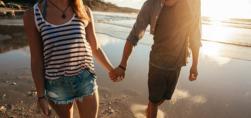 Couple strolling on sea shore
