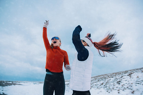 Celebrating female runners enjoying winter fitness success together
