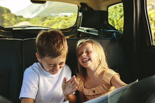 Kids enjoying while travelling by car