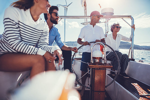 Mature and young couple on boat