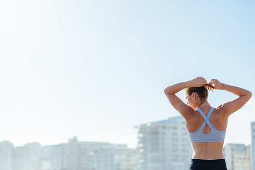 Young woman getting ready for training