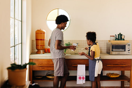 Family baking in the kitchen: Siblings preparing homemade goodness together