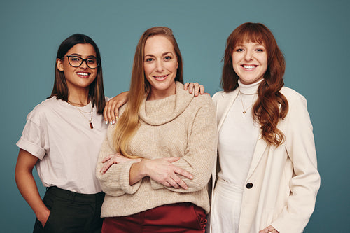 Carefree group of women smiling at the camera
