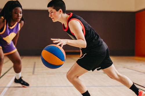Confidence in motion: Female athlete sprints toward the hoop
