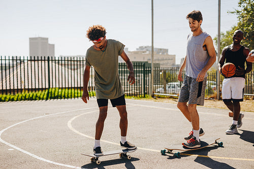 Basketball players skating on skateboard