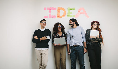 Happy business people standing in office