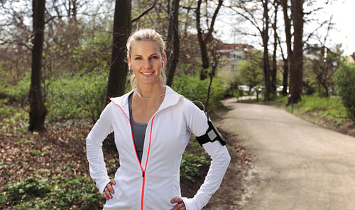Beautiful and confident female runner outdoors